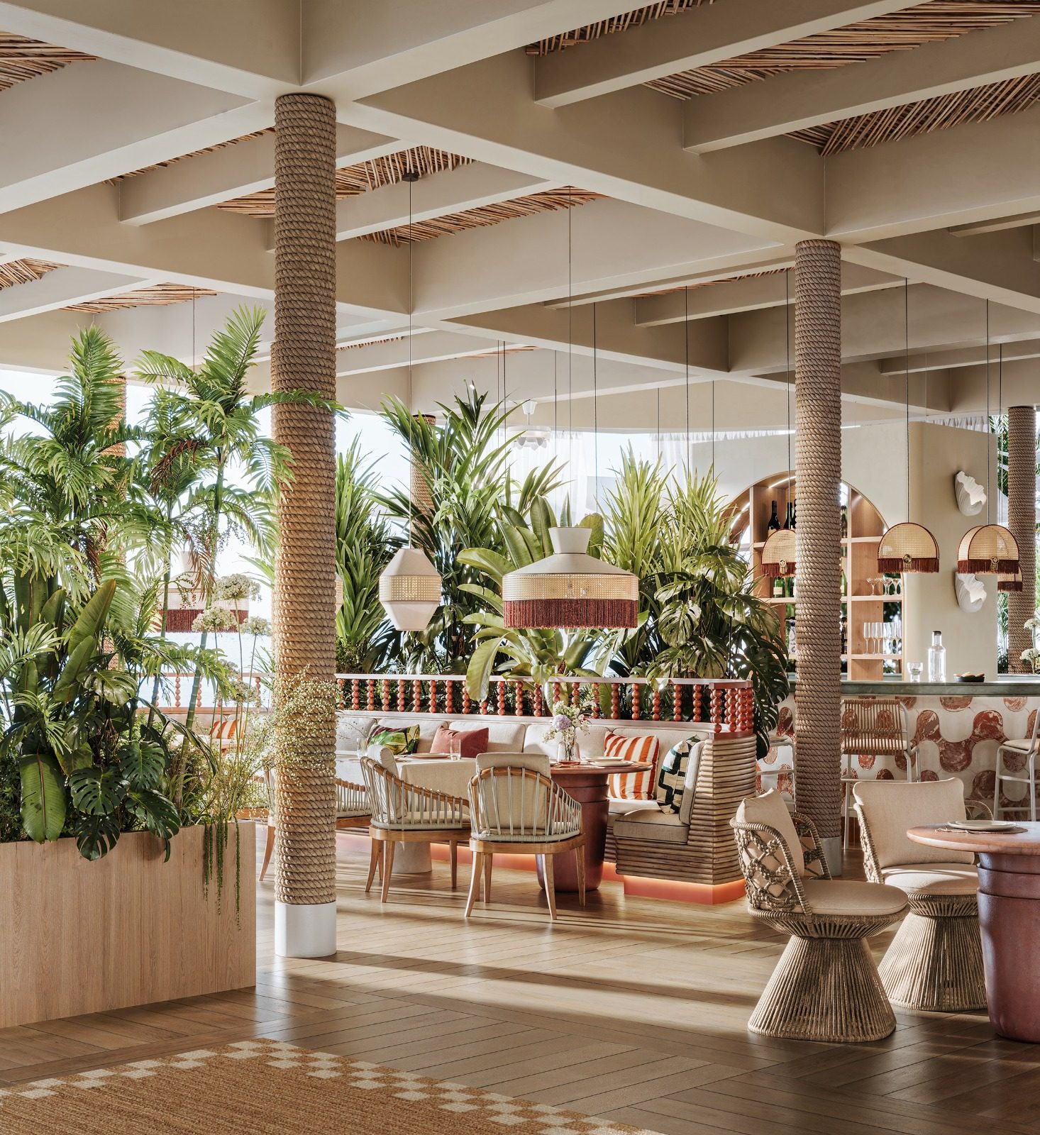 Dining room with rope columns and tropical plants
