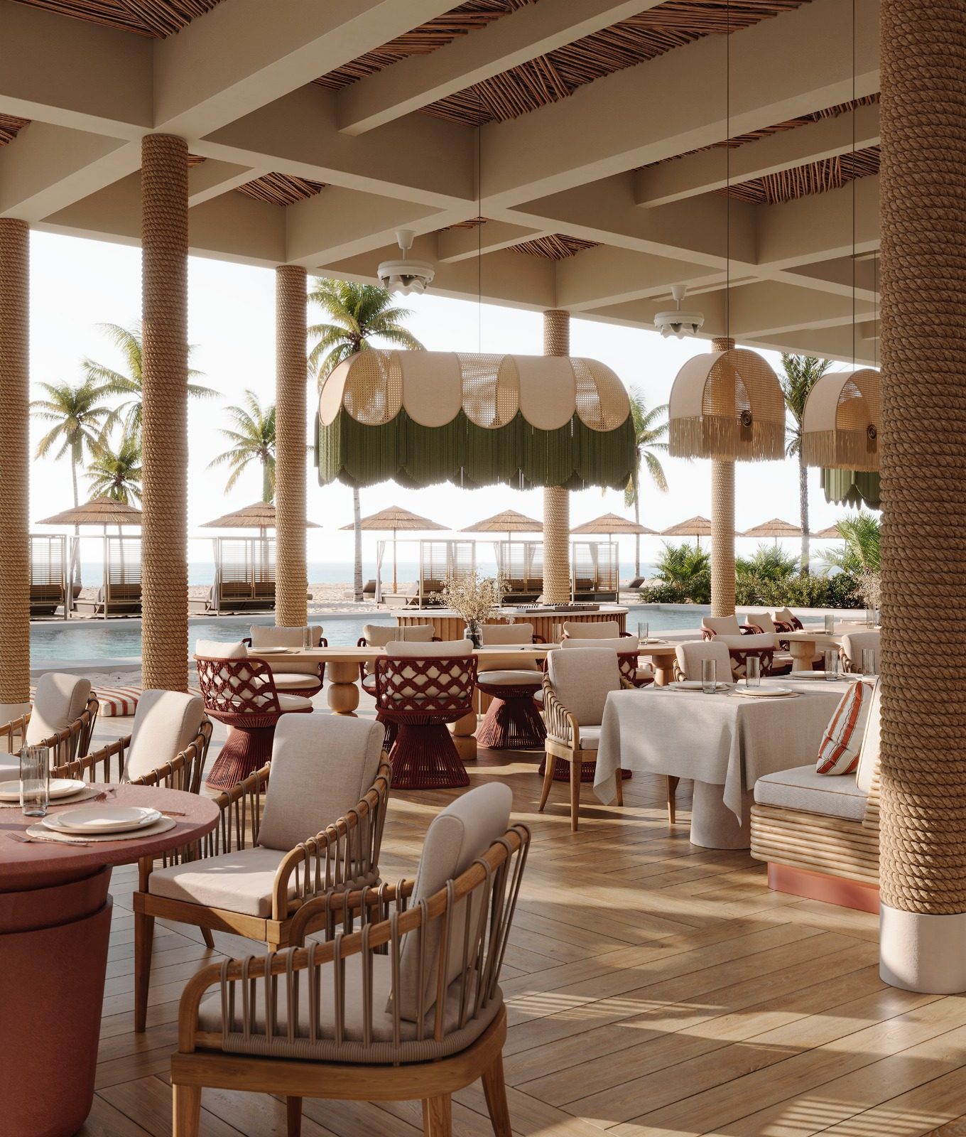Dining terrace overlooking the pool and beach cabanas